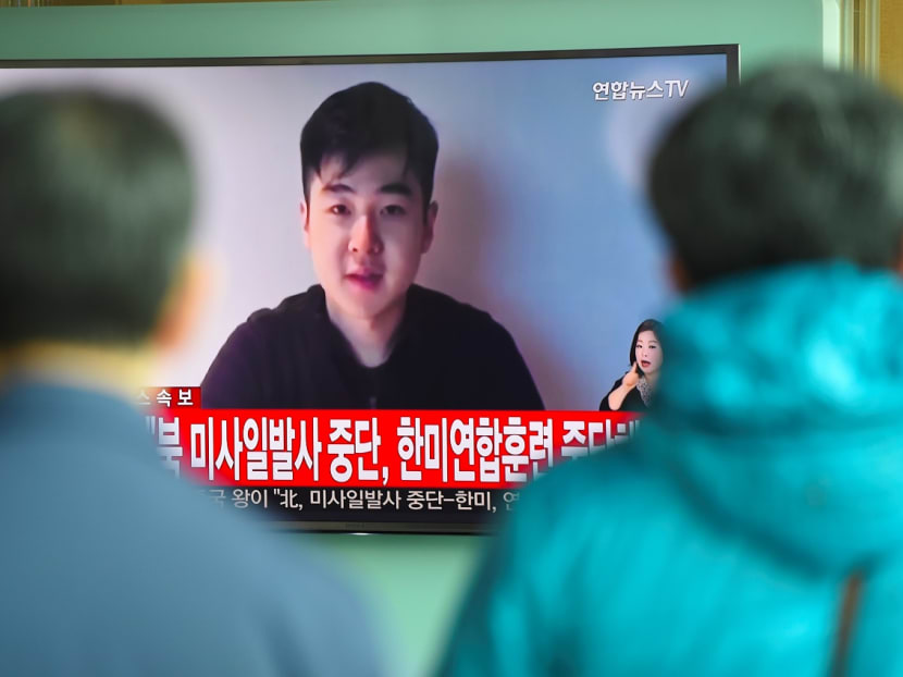 South Koreans watch a television news showing a video footage of a man who claims he is Kim Han-Sol, a nephew of North Korea's leader Kim Jong-Un, at a railway station in Seoul on March 8, 2017. Photo: AFP