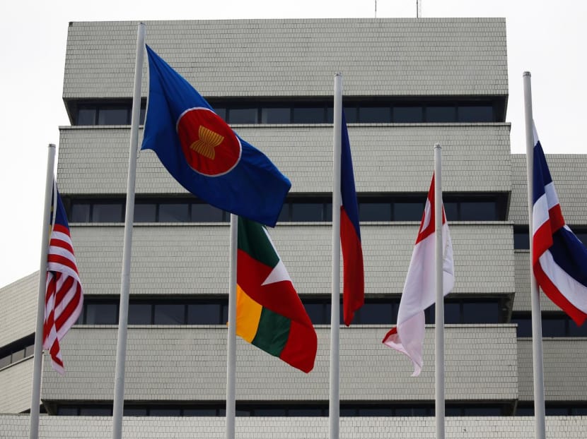 Asean's flag (second from left) along with member states' flags outside the Asean Secretariat in Jakarta. MFA said it condemns Sunday's attack on the Asean convoy of which two Singapore Embassy of Yangon staff were part of. 
