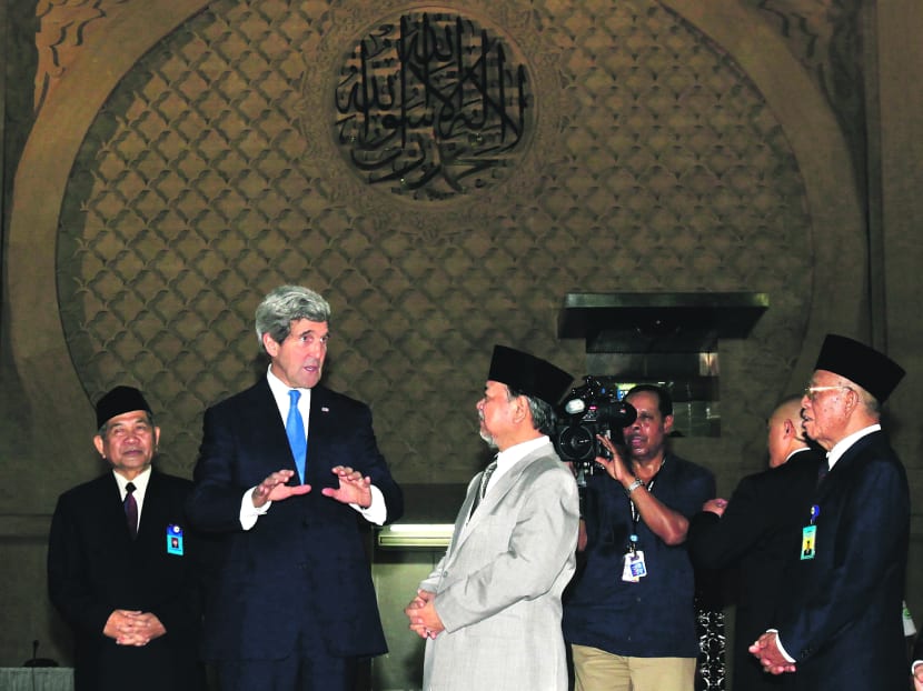 US Secretary of State Kerry (second from left) with the Grand Imam of Istiqlal Mosque Ali Mustafa Yakub in Jakarta yesterday. He visited South-east Asia’s largest mosque, paying tribute to Islam in the world’s most populous Muslim-majority nation. Photo: Reuters