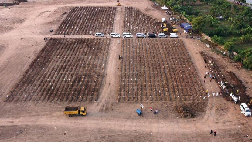 Aerial images of expanding graves capture Indonesia's deadliest days Aerial images of expanding graves capture Indonesia's deadliest days