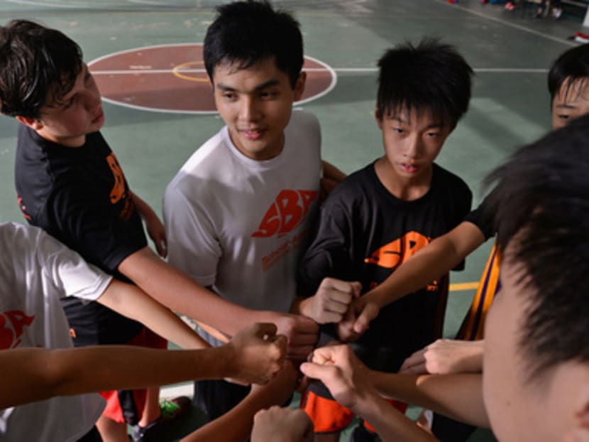 Singapore Slinger Wong Wei Long (in white) with the students from his basketball academy. Photo: Robin Choo