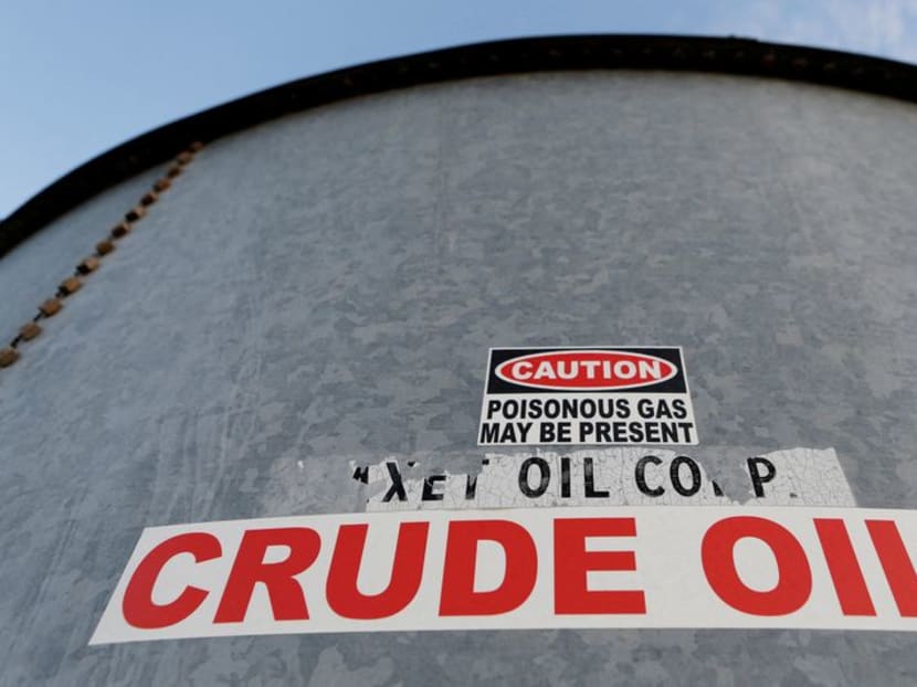 FILE PHOTO: Sticker reads crude oil on the side of a storage tank in the Permian Basin in Mentone, Loving County, Texas, U.S. November 22, 2019.  REUTERS/Angus Mordant