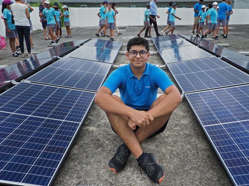 Hemal Arora leads a group of 10th grade students to install solar panels at his school, United World College South East Asia (East). Hemal Arora leads a group of 10th grade students to install solar panels at his school, United World College South East Asia (East).