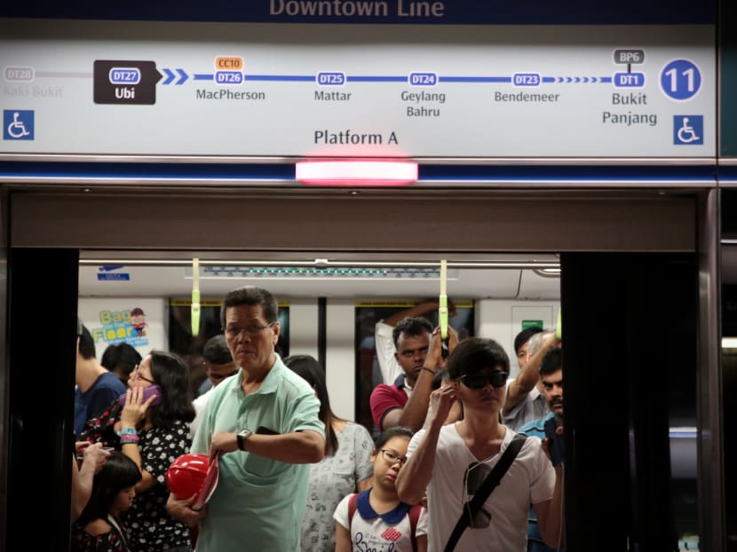 Commuters react during a train delay due to a track fault during the Downtown Line 3 Open House at Kaki Bukit Station. Photo: Jason Quah/TODAY