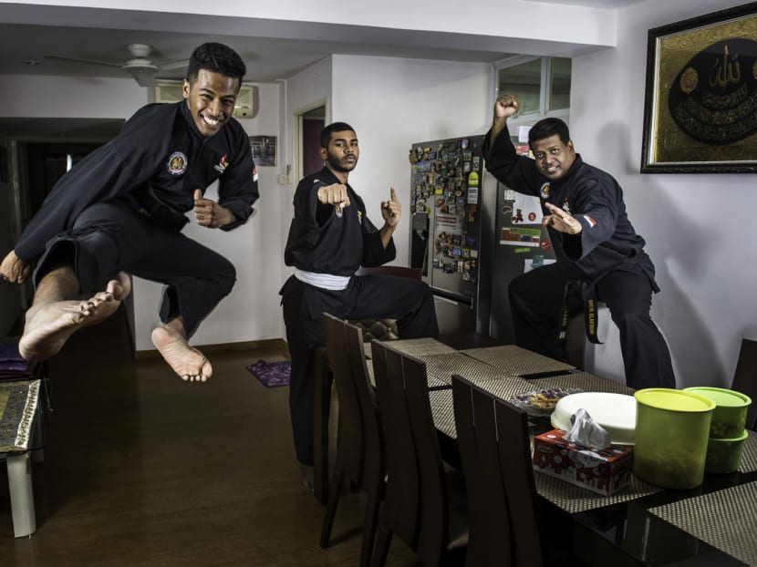 Portrait of silat world champion Sheik Alau'ddin (right) and sons Sheik Farhan (centre) and Sheik Ferdous in their home. Photo: Nuria Ling/TODAY
