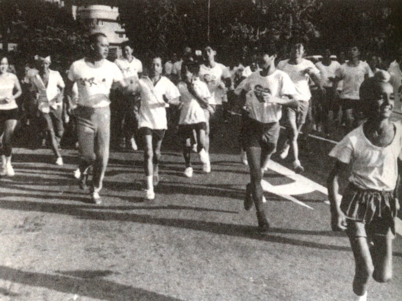 Othman Wok leading joggers on a 3-mile trek during the Sports for All Campaign in 1976. Photo: From the book, Never in My Wildest Dream Othman Wok leading joggers on a 3-mile trek during the Sports for All Campaign in 1976. Photo: From the book, Never in My Wildest Dream