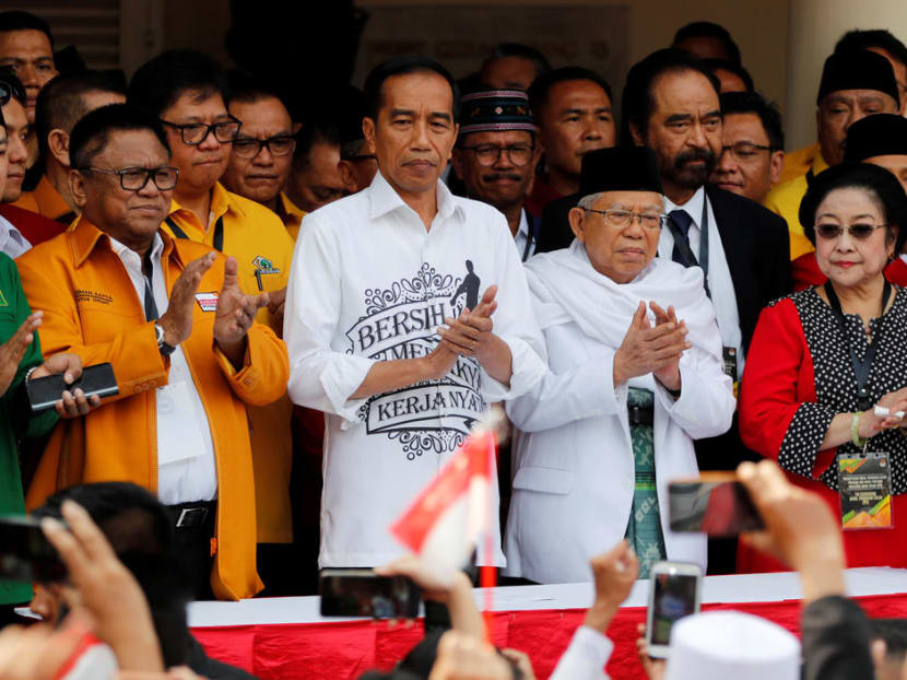 Mr Widodo, seen here with his VP pick Mr Amin, will have to produce a convincing report card for voters to return him for a second term, say the authors.