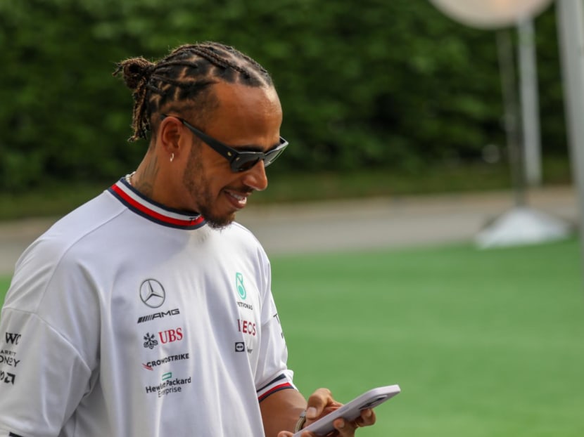 Formula One driver Lewis Hamilton from Mercedes racing team walking around the F1 Pit Building in Singapore on Sept 29, 2022.