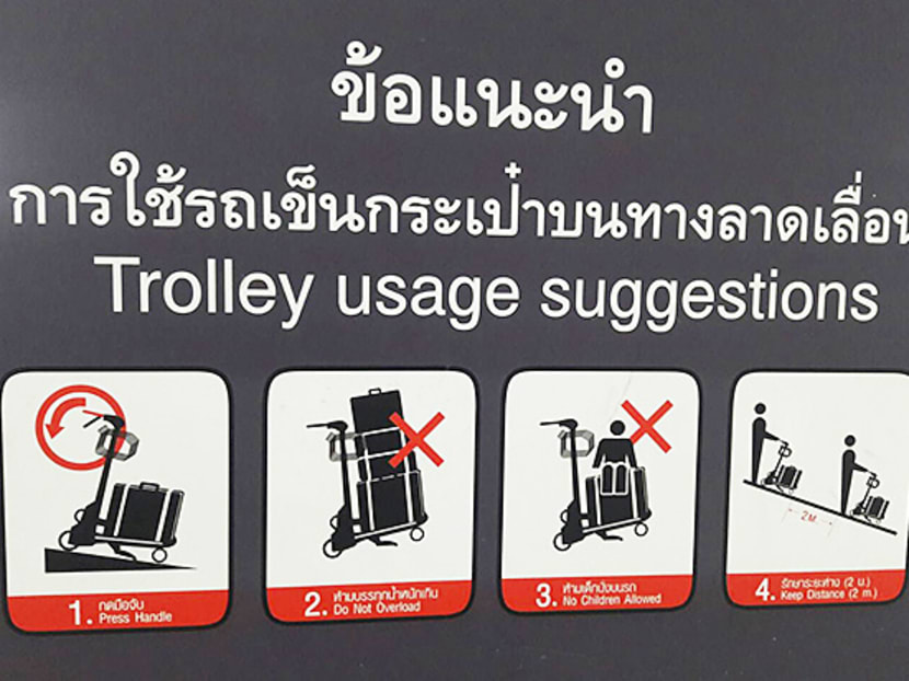 The accident revealed an embarrassing instruction sign that provided wrong details on how to lock the trolleys on the moving stairways. It instructs passengers to press the handle down, when in fact that unlocks the cart. Photo: Bangkok Post