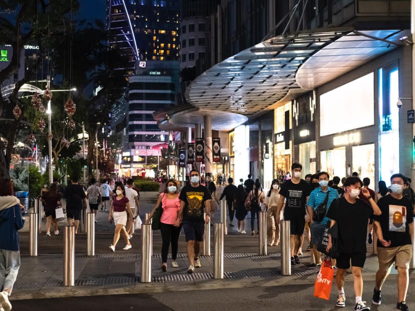 Crowds of people are seen along Orchard Road on Oct 10, 2021.