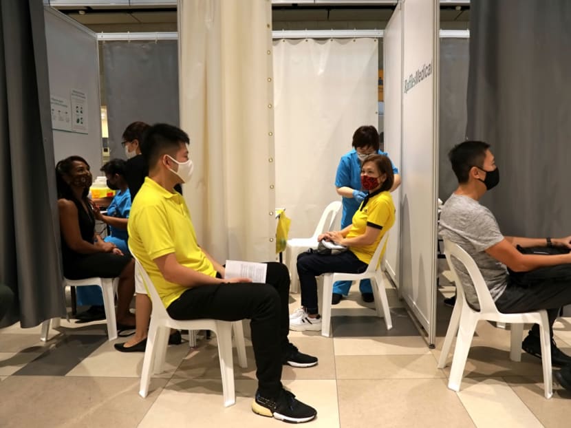 Front-line workers from the aviation and maritime sectors receive their Covid-19 vaccines at the vaccination centre at Changi Airport Terminal 4 on Jan 18, 2021.