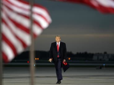 US President Donald Trump arrives for a Make America Great Again campaign event at Des Moines International Airport in Des Moines, Iowa on October 14, 2020.