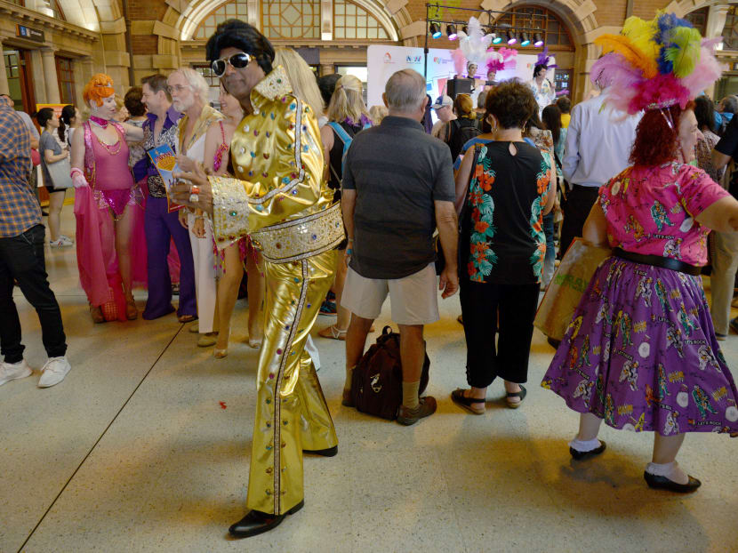 Elvis fans arrive at Central station to board a train to take them to The Parkes Elvis Festival from Sydney on Jan 12, 2017. Photo: AFP