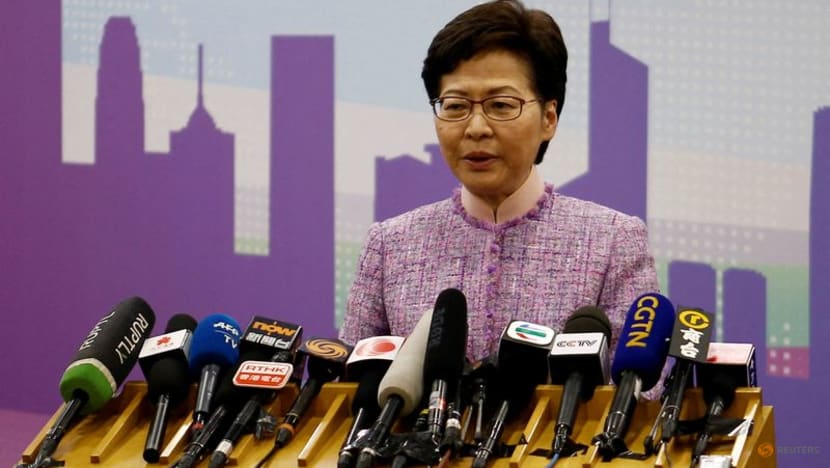Hong Kong leader orders probe of 13 officials who went to COVID-19-hit party