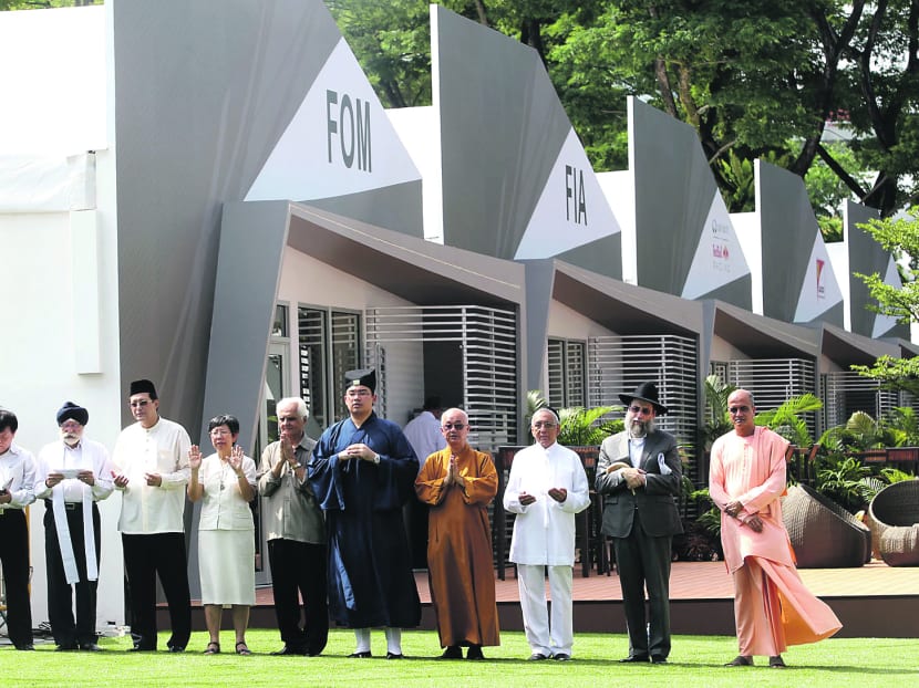 Leaders representing Singapore's 10 faiths bless the Marina Bay track on Sept 12, 2013, ahead of the Singapore Grand Prix, which gets underway on Sept 20, 2013. Photo: Wee Teck Hian