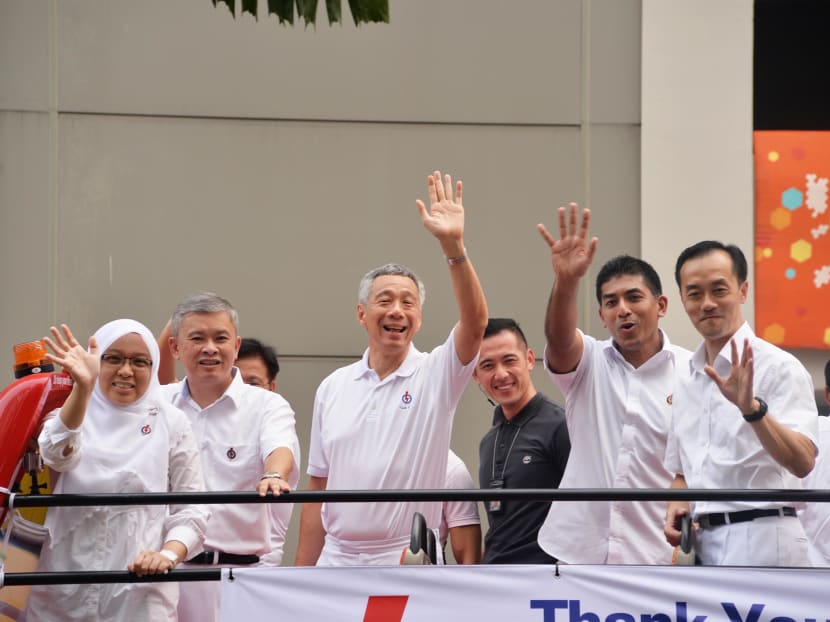 PM Lee Hsien Loong and his team for Ang Mo Kio GRC embarked on a victory parade this afternoon on a bus. Photo: Robin Choo