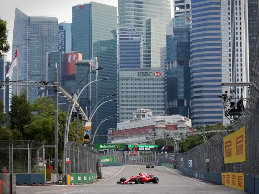 Scuderia Ferrari driver Kimi Räikkönen passes turn 14 with the Singapore CBD skyline in the background during practice on Sept 15. Photo: Nuria Ling/TODAY
