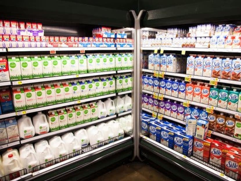 Milk products, left, at a grocery store in Atlanta, Sept 6, 2012.