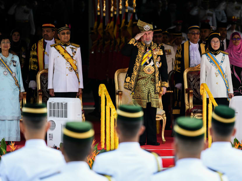 Photo of the day: Malaysia's King Muhammad V (saluting), Malaysian Prime Minister Mahathir Mohamad and his wife Siti Hasmah, and Deputy Prime Minister Wan Azizah Ismail attend the opening ceremony of the 14th Parliament in Kuala Lumpur on Tuesday (July 17).