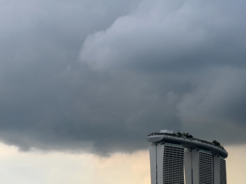 Rain clouds hovers over the Marina Bay Sands hotel and resorts building in Singapore on July 25, 2022. Rain clouds hovers over the Marina Bay Sands hotel and resorts building in Singapore on July 25, 2022.