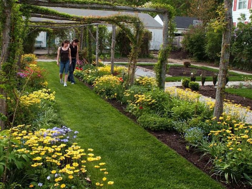 Students visit a garden on the campus of Smith College in Northampton, Massachusetts, in 2005. Photo: AP