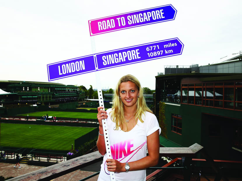 Wimbledon champion Petra Kvitova with a Road to Singapore sign to promote the WTA finals in Singapore, which will be held from Oct 20 to 26. 
Photo: Getty Images