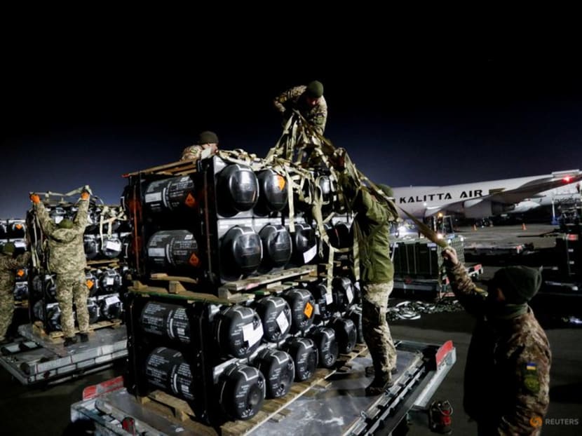 FILE PHOTO: Ukrainian service members unpack Javelin anti-tank missiles, delivered by plane as part of the U.S. military support package for Ukraine, at the Boryspil International Airport outside Kyiv, Ukraine February 10, 2022.  REUTERS/Valentyn Ogirenko