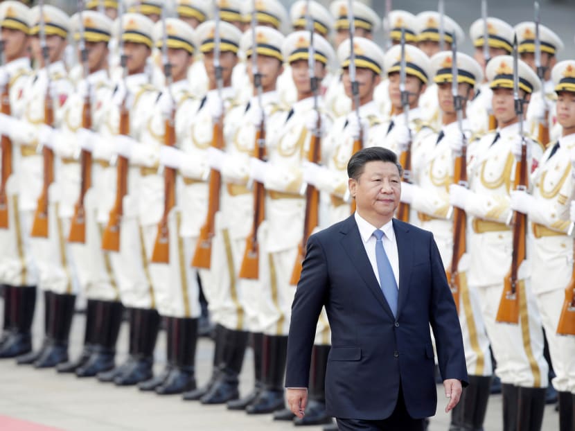 President Xi Jinping reviews honour guards in Beijing, China, last month. Mr Xi is preparing for a second five-year term as national leader. Photo: Reuters