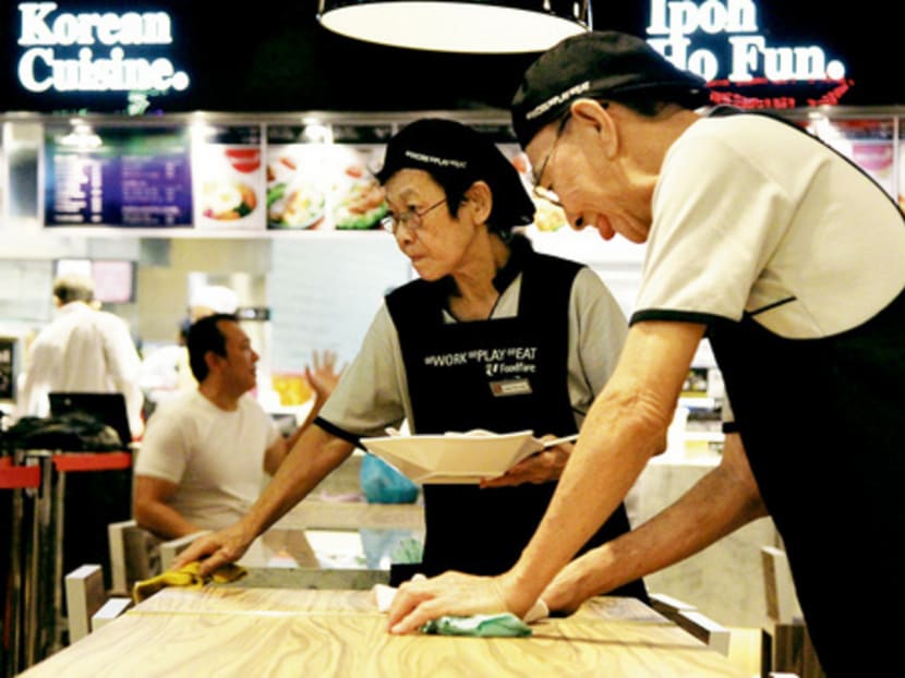 Elderly staff clearing tables at a food court. Retirement. Old age employment. Photo by Don Wong, 26 Sep 2012.