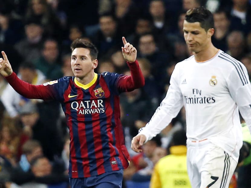 Barcelona's Lionel Messi (L) and Real Madrid's Cristiano Ronaldo. Reuters file photo