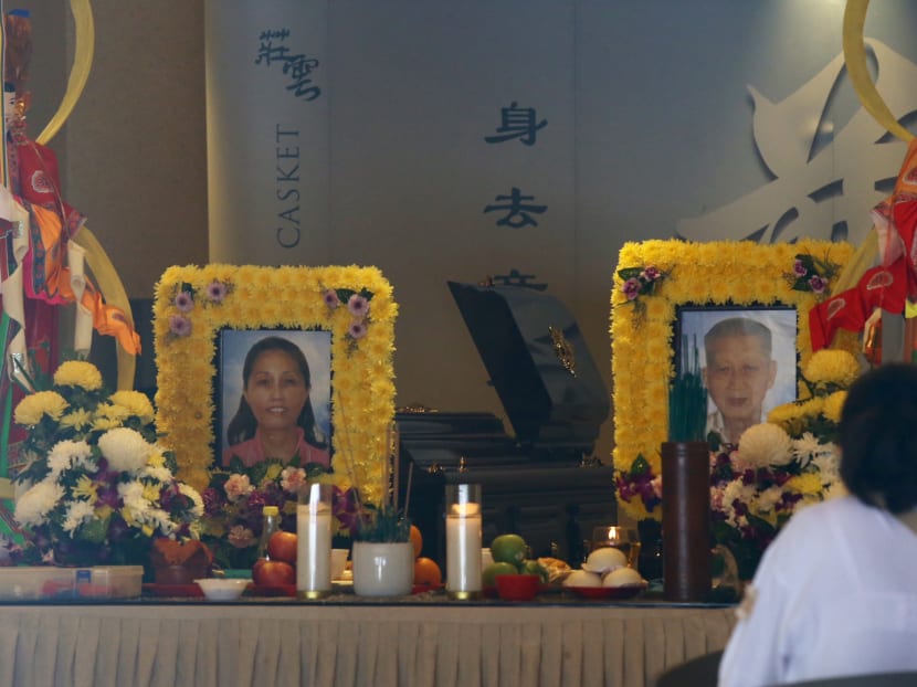 The photos of Yio Chu Kang accident victims, Mr Chua Cheng Thong and his daughter Ms Gina Chua Aye Wah, placed at their wake in Ang Yew Seng Funeral Parlour's Pearl Hall on Wednesday (April 25).