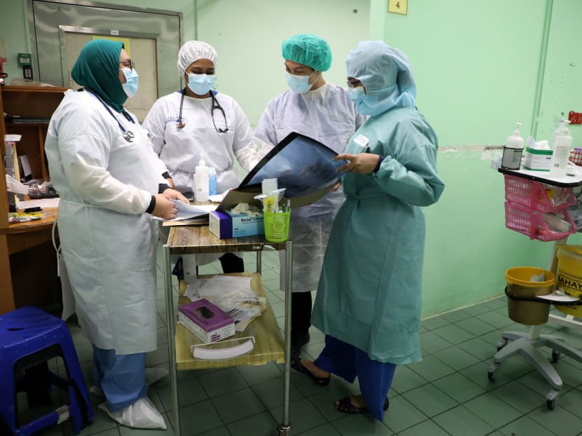 Health workers wearing protective suits work at emergency department in the Kuala Lumpur Hospital, amid the coronavirus disease outbreak, in Kuala Lumpur, Malaysia.