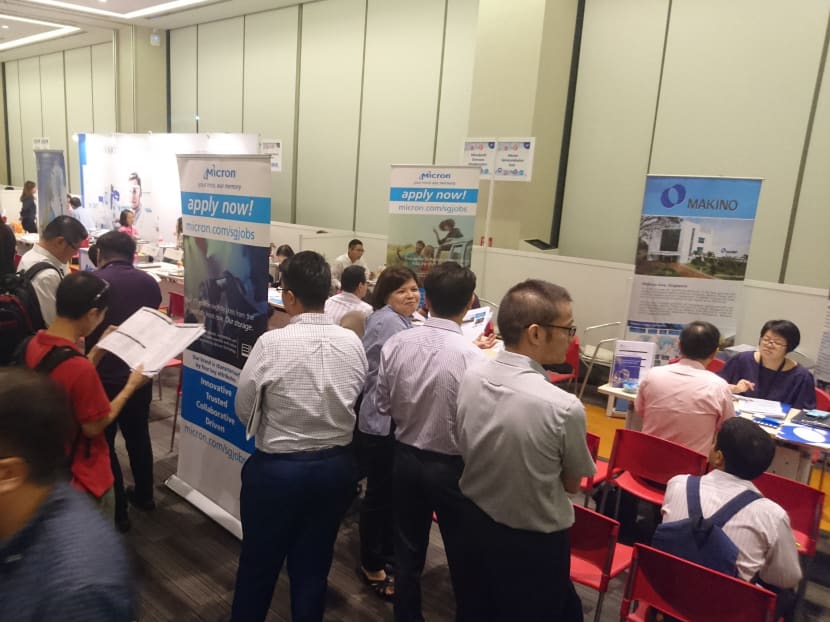 Visitors are seen during a career fair on the Adapt and Grow Manufacturing Day held at the Devan Nair Institute for Employment and Employability. April 27, 2017. Photo: Koh Mui Fong/TODAY
