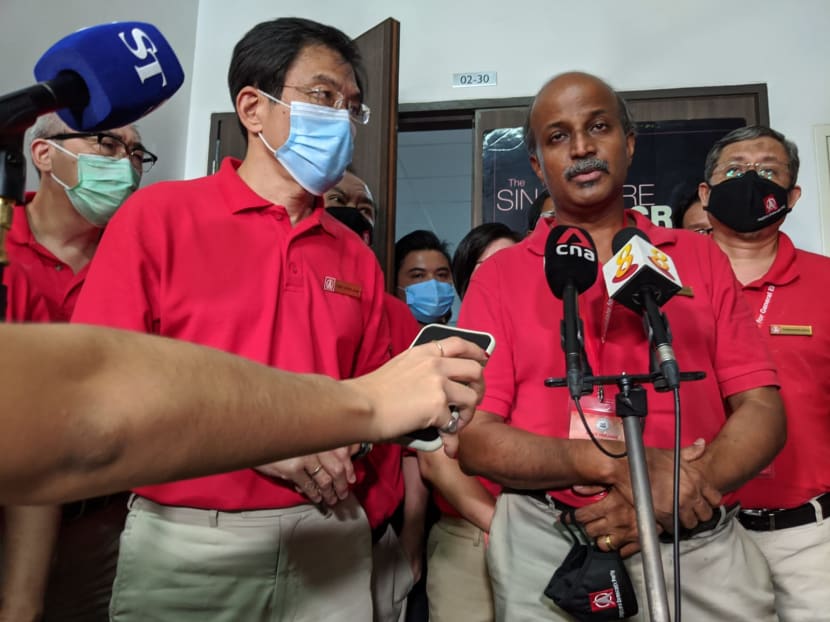 Dr Chee Soon Juan (second from left) and Dr Paul Tambyah (second from right) speaking to reporters outside the Singapore Democratic Party's headquarters in Ang Mo Kio on July 11, 2020.