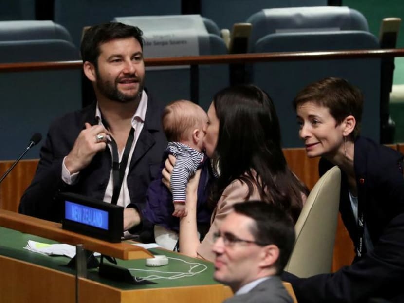 New Zealand prime minister Jacinda Ardern kisses her baby Neve after speaking at the United Nations General Assembly last year. The author suggests that motherhood is arguably the most significant turning point in a woman’s professional life.