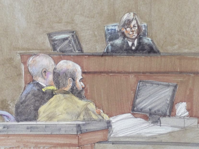 US Army Major Nidal Hasan (centre) and defence attorney Lt Col Kris Poppe (left) are shown in this courtroom sketch as Judge Tara Osborn gives sentencing instructions to the panel in Fort Hood, Texas, on Aug 28, 2013. Photo: Reuters