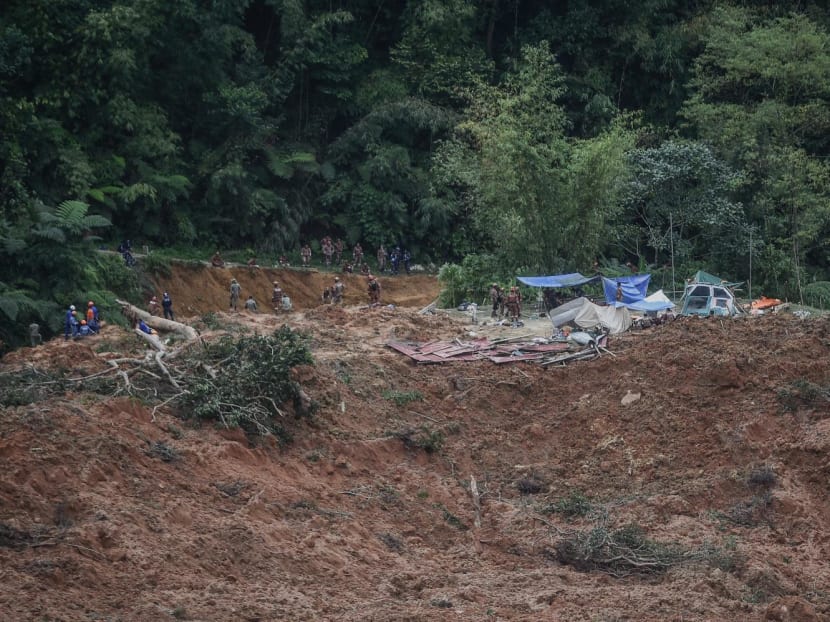 Malaysia authorities inspect the site damaged after a landslide in Batang Kali, Selangor on Dec 16, 2022.
