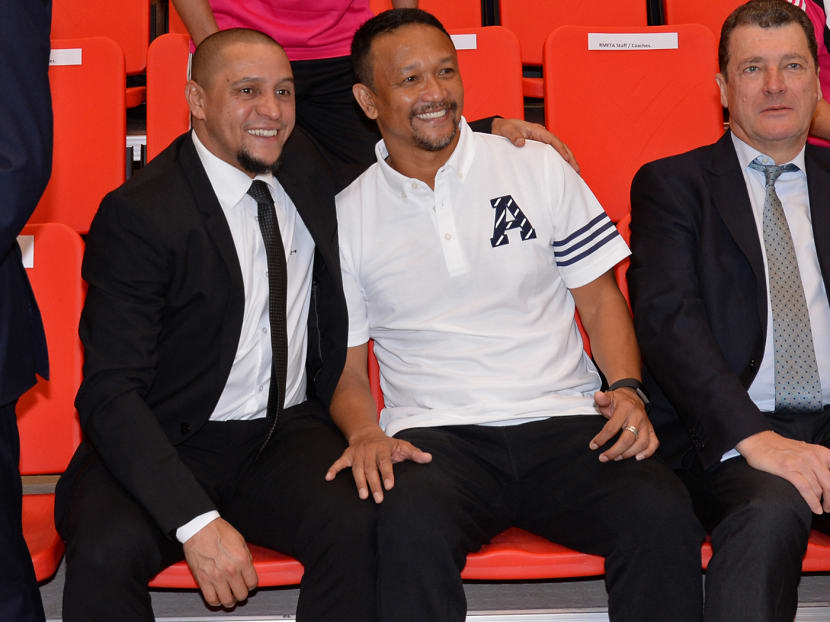 Singapore football legend Fandi Ahmad (right) and Brazillian Real Madrid football legend Roberto Carlos posing for photos at a sharing session at ITE College Central, on 13 February 2017. Photo: Robin Choo/TODAY