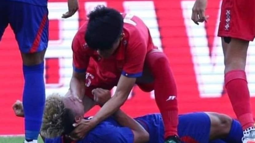 Laos footballer praised for helping Cambodian opponent after collision during SEA Games match Laos footballer praised for helping Cambodian opponent after collision during SEA Games match