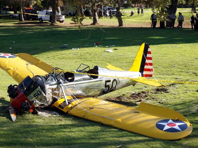 A small vintage airplane rests on the ground after it crash-landed on the Penmar Golf Course in the Venice area of Los Angeles, yesterday (March 5). Photo: AP