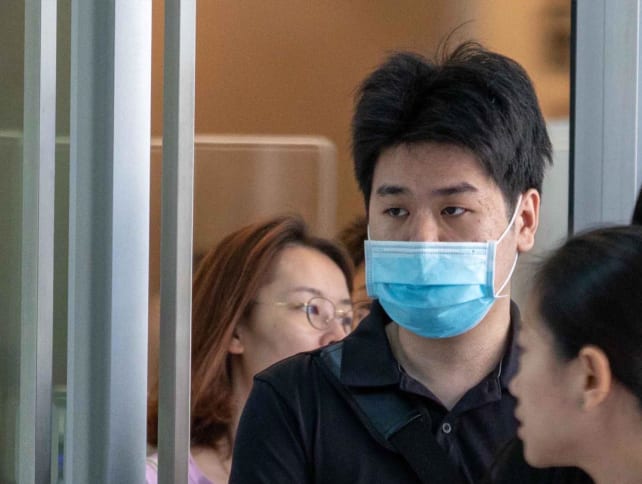 Ng Yong Kuan (with face mask) at the State Courts in October 2023.