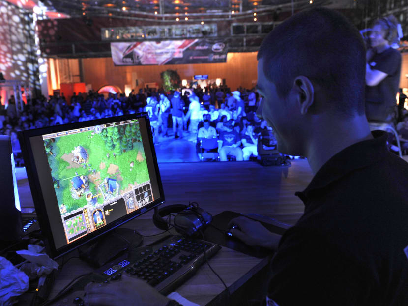 In this Aug 7, 2009, file photo, a participant plays a computer game during the Intel Friday Night Game, a competition of the ESL, Electronic Sports League, in Dresden, Germany. Photo: AP