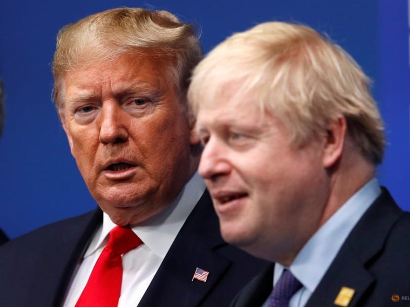 FILE PHOTO: Britain's Prime Minister Boris Johnson welcomes U.S. President Donald Trump at the NATO leaders summit in Watford, Britain December 4, 2019. REUTERS/Peter Nicholls/Pool