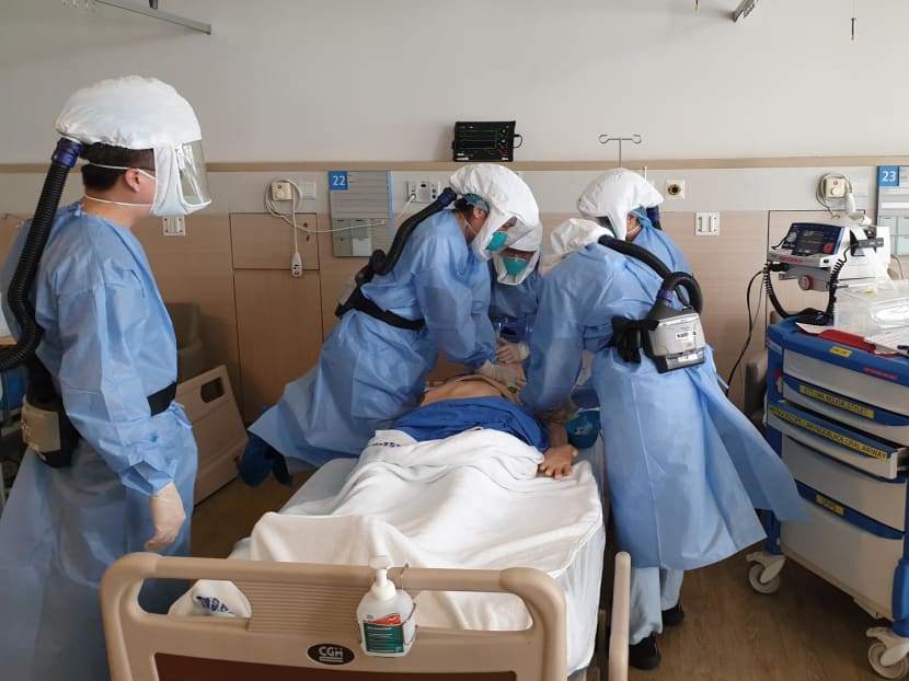 Ms Mashithah Mansor, a nurse clinician from Changi General Hospital, undergoing simulation training on emergency resuscitation with colleagues from a medical emergency team during the Covid-19 pandemic.

