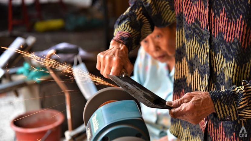 'We do it to keep busy': Elderly sisters continue knife sharpening trade in Kuala Lumpur