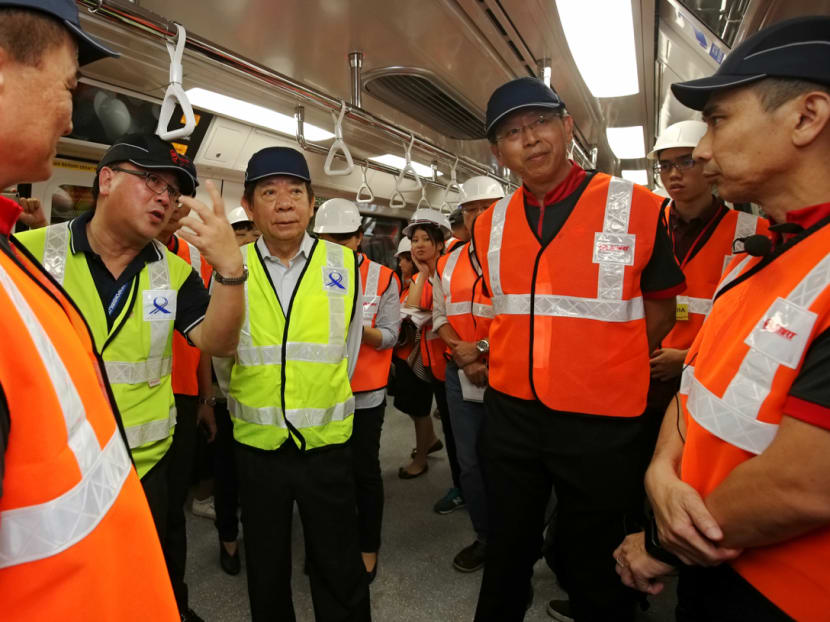 New SMRT chief executive Neo Kian Hong (2nd from right) at Bishan depot on Monday (Aug 13) with Transport Minister Khaw Boon Wan and other senior officials to view the new trains that would be added to the North-South and East-West rail lines from next month.