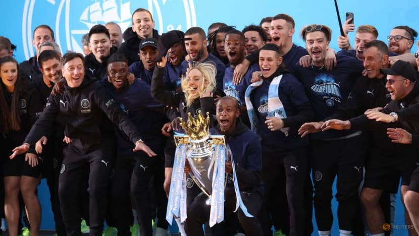 Champions Manchester City paint town blue with open top bus parade