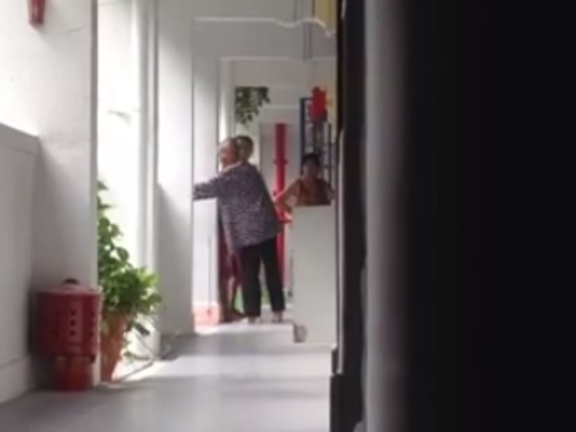 A screencapture from a video shared by Facebook user ApohTecky Numero of an elderly woman being hit by a younger woman.
