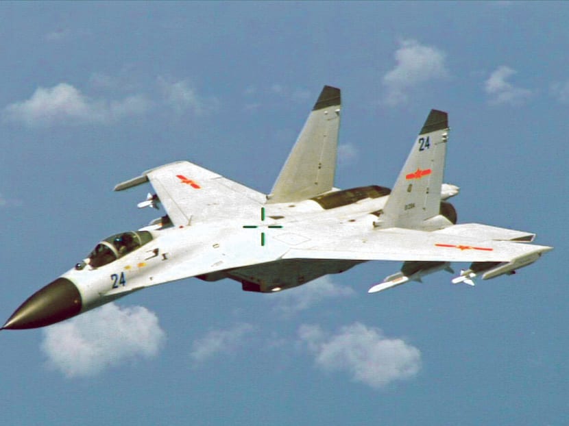 A Chinese fighter jet flying near a US P-8 Poseidon east of Hainan Island in August. The Pentagon has described the incident as unsafe and unprofessional. Photo: Reuters