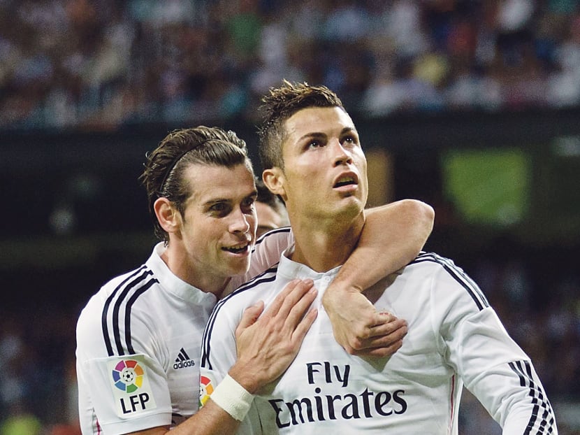 Bale (left, with Ronaldo) is the only British player to make the top 10 of the Ballon d’Or list. GETTY IMAGES